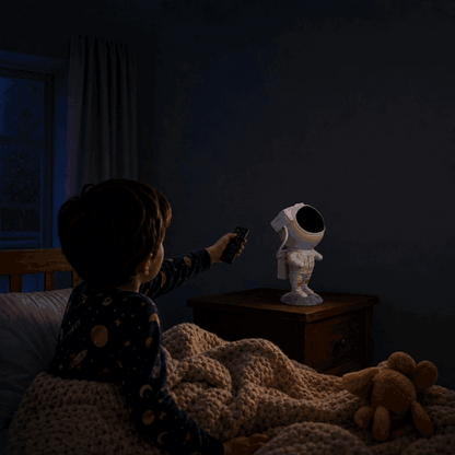 Boy switches on the Astronaut star projector with the remote control, galaxy appears on the kids room ceiling