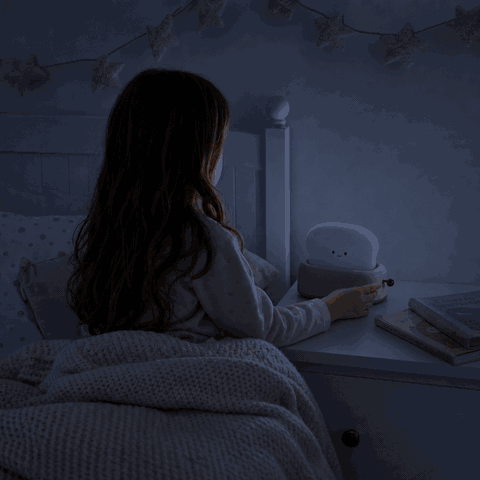 Girl switches on the ToastLight toaster night light in the kids room