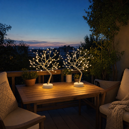 Two cordless LED light trees on the terrace at dusk