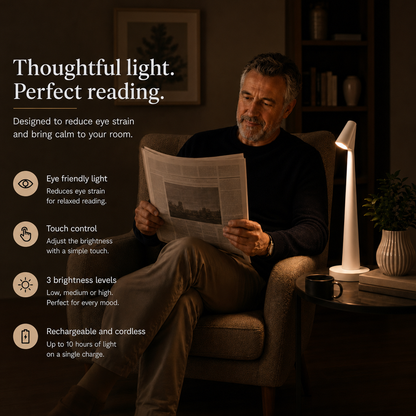 Man reading the newspaper with the white LumiNord reading lamp, eye friendly light and touch control