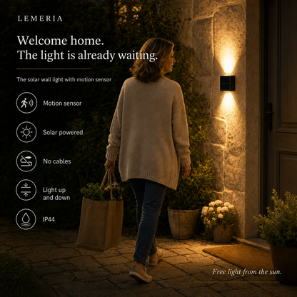 Woman comes home in the evening, the SolarGlow solar outdoor light switches on automatically via motion sensor