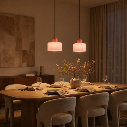 Two Colora glass pendant lights above a laid dining table