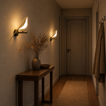 Two Avia LED bird wall lights in the hallway above a console table