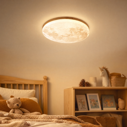LED moon ceiling light Luna with light wood frame glowing in a cozy kids room
